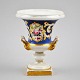 German 
porcelain vase, 
19th century. 
White porcelain 
decorated with 
gold, blue base 
and flowers. 
...