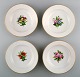 4 antique Royal Copenhagen deep plates in flora danica style.
