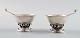 Georg Jensen: Two salt cellars with matching salt spoons.
