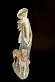 Lladro, Dame 
med hund og 
paraply. Der er 
afslag på 
paraplyen se 
foto. Højde 
39,5 cm. Længde 
21 ...