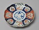 Imari Japansk 
porcelænstallerken, 
19. årh. 
Dekoreret med 
planteornamentik 
og traner. 
Diameter: ...