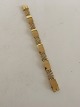 Georg Jensen 
18K Guld 
Armbånd No. 
314B, designet 
af Harald 
Nielsen. 18.5 
cm L. 1.2 cm 
bredt. ...