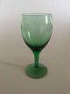 Kirsten Pil 
Green White 
Wine Glass from 
Holmegaard. 13 
cm H. The glass 
is ingraved 
with round ...