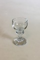 "Jægerglas" 
Portvinsglas 
fra Holmegaard. 
Måler 11,5 cm. 
Designet af Per 
Lütken 1974.