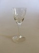 Holmegaard Ulla 
Snapseglas . 
Måler 10 cm H. 
Glas med kryds 
og skær 
slibning på 
glat stilk.