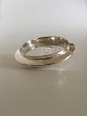 Hans Hansen 
Sterling Sølv 
Armbånd. Måler: 
Indvendig 
diameter 6,4 
cm, Bredde 1,6 
cm. Vejer 62 g.