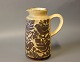 Keramik kande i 
brune farver 
med 
fuglemotiver af 
Michael 
Andersen & Søn, 
nummeret 6427.
H - 19 ...