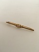 Georg Jensen 
18K Guld Broche 
No. 237 prydet 
med Diamant. 
5.3 cm L. Vejer 
5 gram.