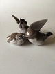 Bing & Grøndahl 
Figur No. 1670 
af Spurve Trio. 
10 cm H. 18 cm 
Bred.