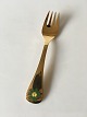 Georg Jensen 
1982 Annual 
Fork in Gilded 
Sterling Silver 
with Enamel. 
14.6 cm L
