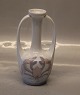 Royal 
Copenhagen 
334-60 A RC Art 
Nouveau vase 
with seaweed 
decoration and 
two handles 
17.5 cm In ...