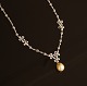 Necklace, 18ct whitegold with numerous diamonds and pearl. L: 42cm