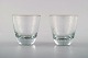 Tapio Wirkkala 
for Iittala. 
Finland 
1960´erne.
2 vodkaglas i 
klart kunstglas 
indgraveret ...