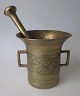 Baroque 18th 
century brass 
mortar with 
pistil. Two 
handles. With 
plant 
decorations on 
the ...