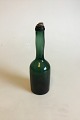 Olivengrøn 
Arrakflaske, i 
Kastrup 
priskatalog fra 
1853. Måler 23 
cm. Fin stand