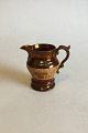 English Lustre 
pottery 
Pitcher. 
Measures 11 cm 
/ 4 21/64 in.