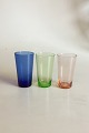 3 Vandglas af 
blåt, grønt og 
orange glas. 
Måler ca. 9,5 
cm Holmegaard