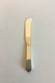 Georg Jensen 
Sterling Silver 
Pyramid Butter 
Knife, All 
Silver No 46. 
Measures 14.4 
cm / 5 43/64 
in.