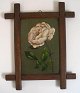 Dansk 
blomstermaler 
(19. årh.): En 
lyserød rose. 
Olie på pap. 
15,5 x 11 cm. 
Sign.: Monogram 
WK ...