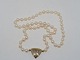 Genuine pearl 
necklace with 
14 carat gold 
pendant with 8 
diamonds.
Hallmarked 
"585".
The ...