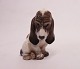 Dahl Jensen 
porcelænsfigur, 
Basset Hound, 
nr. 1065.
Mål: 
15x8,5x7,5 cm.
