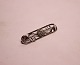 Oblong brooch 
in 830 silver.
5.5x1.5 cm.
