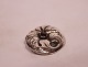 Brooch 
decorated with 
purple stone of 
830 silver.
4x3.5 cm.