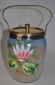Bisquit bucket 
in painted 
glass, approx. 
1900. Flower 
paintings with 
enamel. With 
handle and lid 
...