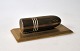 Brevpresse i 
messing, 20. 
årh. Danmark. 
Udformet som en 
granat. 16 x 
8,5 cm. 