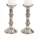 A pair of mid 18th century Baroque church candlesticks with the engraving "Sankt 
Paulus 1761". H: 28cm. F D: 14cm