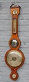 English wheel 
barometer, 19th 
century.