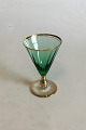 Ida 
Hvidvinsglas, 
Grønt med 
optiske striber 
og guld. Måler 
13 cm
