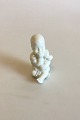 Royal 
Copenhagen 
Blanc de Chine 
Figur af Baby 
med blomster. 
Juliane Marie 
Mærke. Måler 7 
cm