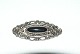 Elegant Silver Brooch with Onyx