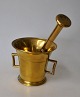 Brass mortar 
with pistil, 
19th century 
Denmark. H: 9.5 
cm. Length of 
pistil: 18.5 
cm.