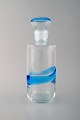 Scandinavian glass art. Carafe in clear and light blue art glass. 1970