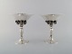 Johan Rohde for Georg Jensen. A pair of grape centrepieces in hammered sterling 
silver. Model number 263. Dated 1925-1932.