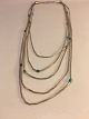 5 Radet Sølv 
halskæde med 
Turkis.
Sølv Sterling.
kæde: længde: 
54,5 cm.
kontakt 
Telefon ...