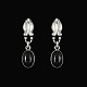 Georg Jensen. 
Øreringe i 
sterlingsølv 
med Onyx #17.
Tegnet af 
Georg Jensen 
1866 - 1935 ...