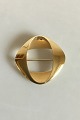 Georg Jensen 
Firkantet 
broche af 18 
karat guld No 
1368. Måler 4 
cm x 4 cm. 
Vejer 16 gram