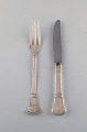 Middagskniv og 
gaffel i 
tretårnet sølv. 
1920'erne.
Stemplet : CFH 
: Christian Fr. 
Heise ...