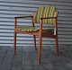 Arne Wooder, 
armstol 
betrukket med 
originalt 
stribet stof, 
stolen er lavet 
i teaktræ
Design ...