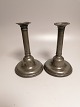 Pair of 19th 
century tin 
sticks on round 
foot stamp 
Height 19cm.