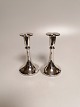 A pair of silver candlesticks 830s