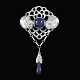 Evald Nielsen 
1879 - 1958. 
Art Nouveau 
Silver Brooch 
with Lapis 
Lazuli
Designed and 
crafted by ...