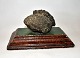 Letter Press. 
Large pyrite 
mounted on 
glazed clay 
base, ...