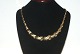Elegant 
halskæde med  
forløb  i 14 
karat guld
Stemplet SOZER 
585
Længde 42,5 cm
Brede   ...