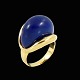 Ring i 18k guld 
med Lapis 
Lazuli.
Stemplet 750.
Str. 54mm.
1,8 x 1,8 cm.
Vægt 14 g.
Brugt i ...