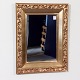 Spejl i 
forgyldt ramme, 
(HxB 89x67 cm), 
ca. 1930