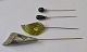 4 old hat pins, 
20th century.